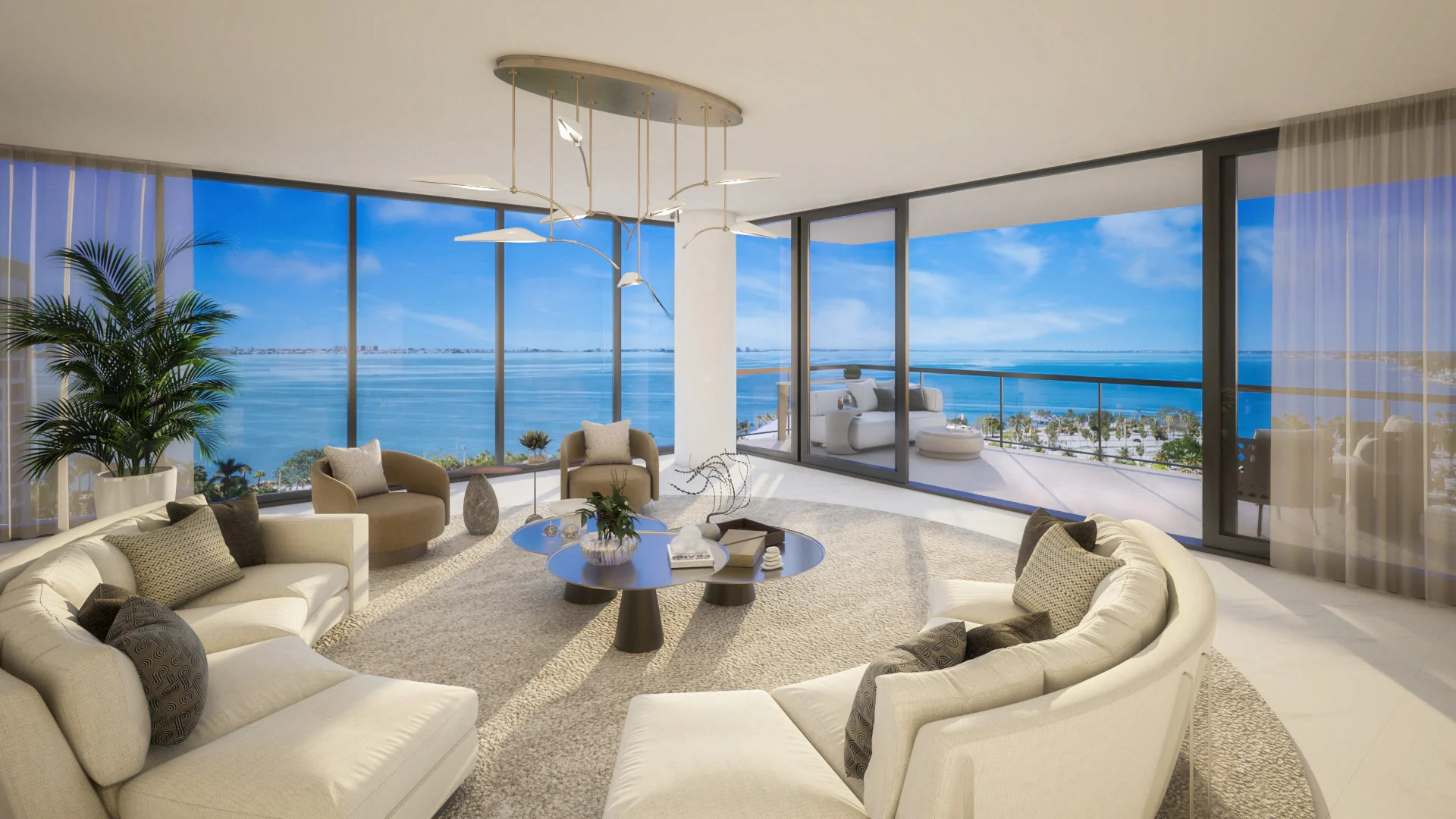 Rendering of a living room with two curved cream sofas, two tan swivel chairs, and nested round coffee tables on a round rug, under a leaf-shaped chandelier, with corner windows and a terrace overlooking the bay.