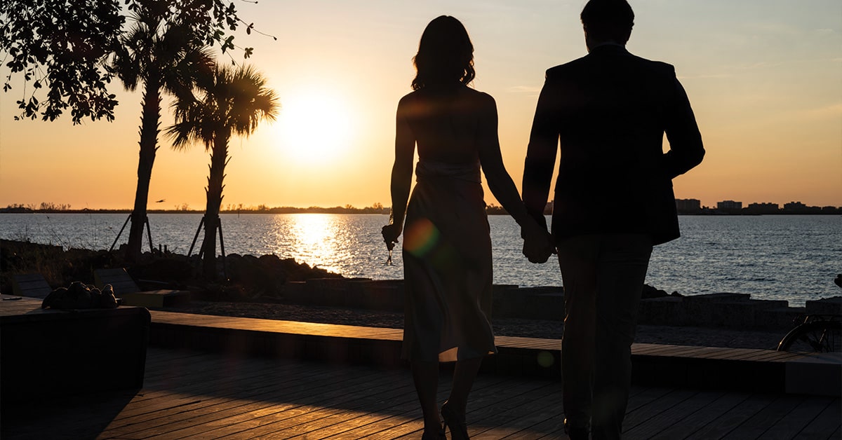 Couple walking the sunset along Sarasota Bay Park