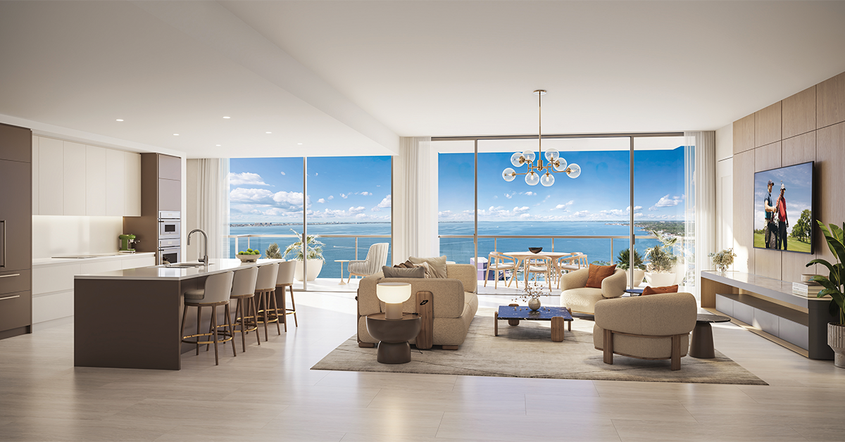 Modern waterfront condominium interior with large windows overlooking bay and balcony seating.