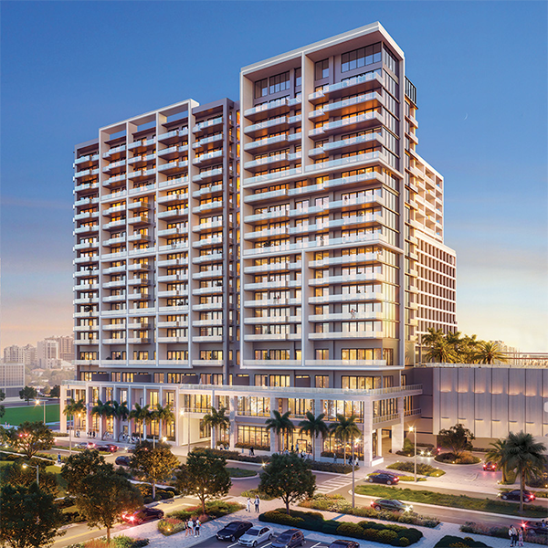 Exterior rendering of modern high-rise condominium building at dusk with palm trees.