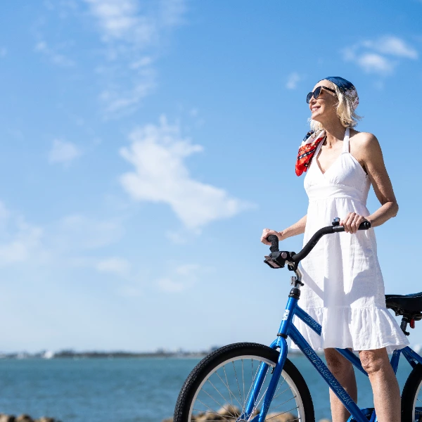 Woman riding a bicycle along Sarasota waterfront