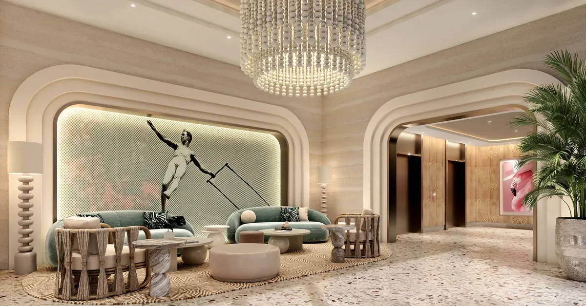 Luxury hotel lobby featuring sage velvet curved sofas, terrazzo floors, a beaded chandelier, and dramatic arched walls with backlit artwork.