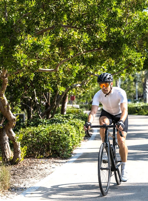 Residents cycling along Sarasota waterfront near 1000 Boulevard of the Arts downtown location