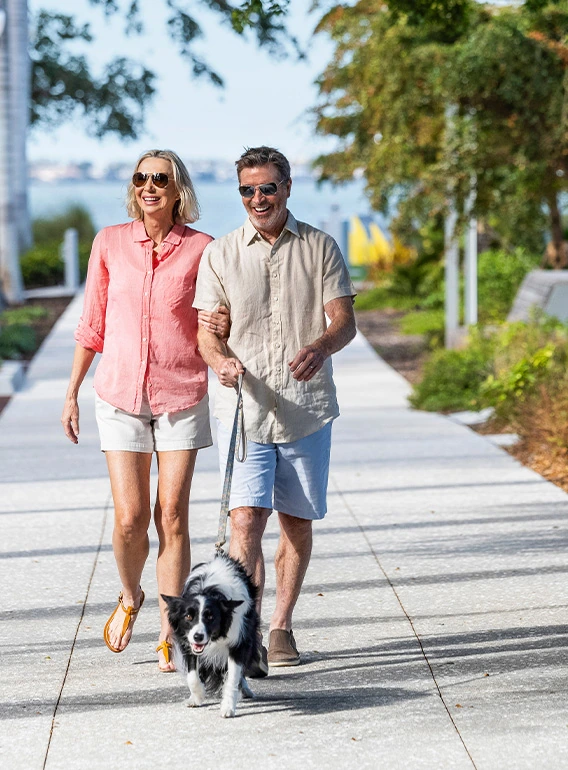 Pet owners enjoying the waterfront with their dogs at 1000 Boulevard of the Arts in downtown Sarasota