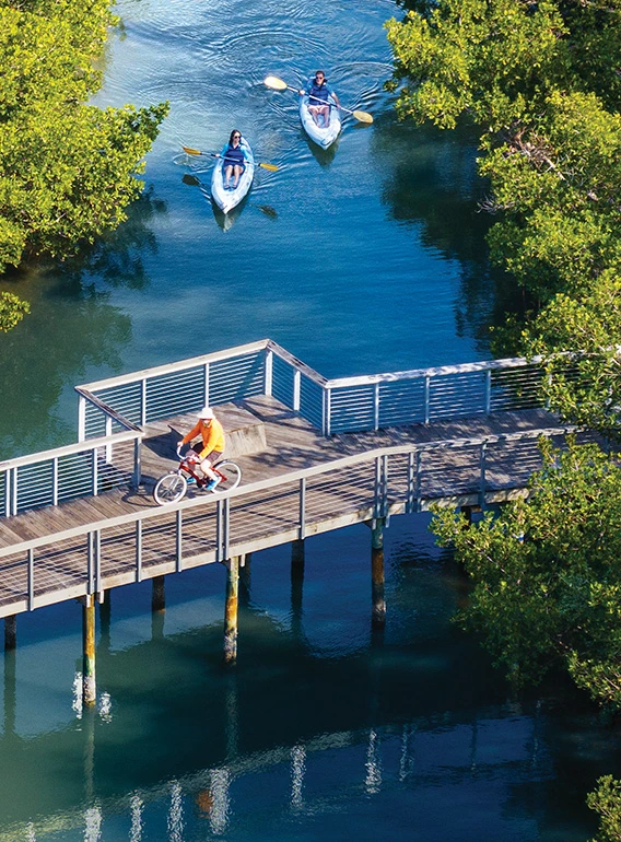 Residents kayaking and enjoying water sports in Sarasota Bay near 1000 Boulevard of the Arts in downtown